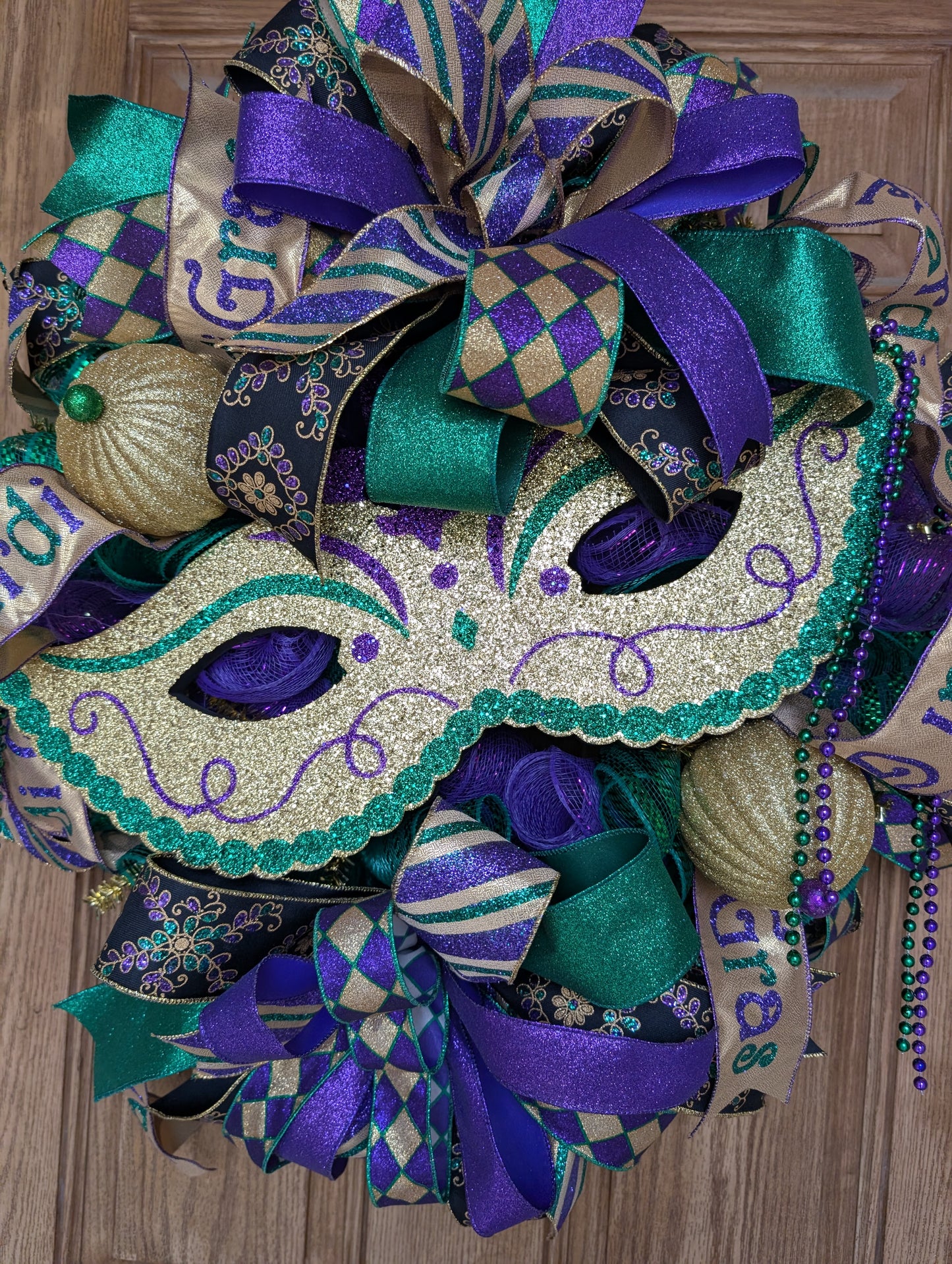 Mardi Gras mask wreath door hanger