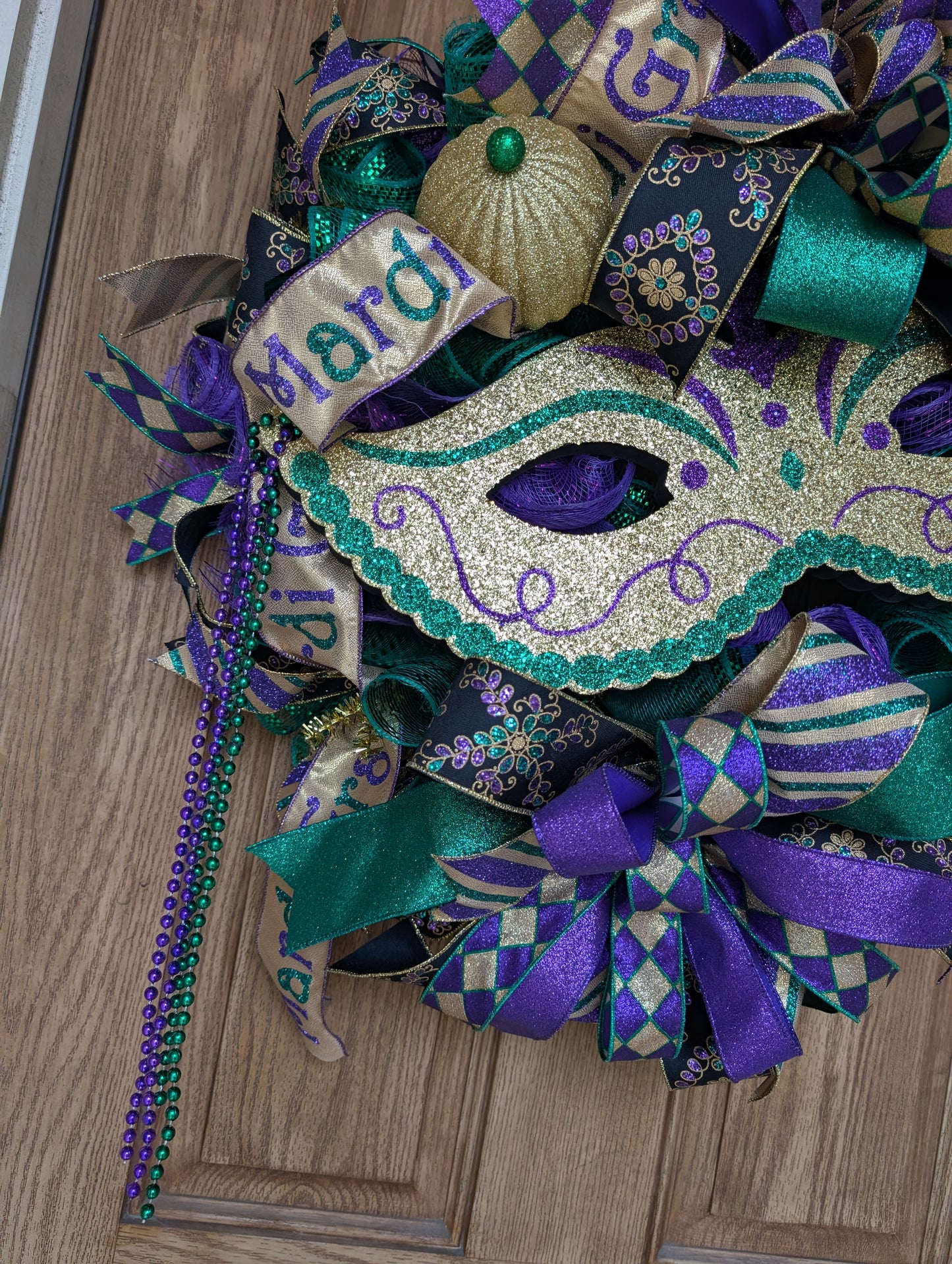 Mardi Gras mask wreath door hanger