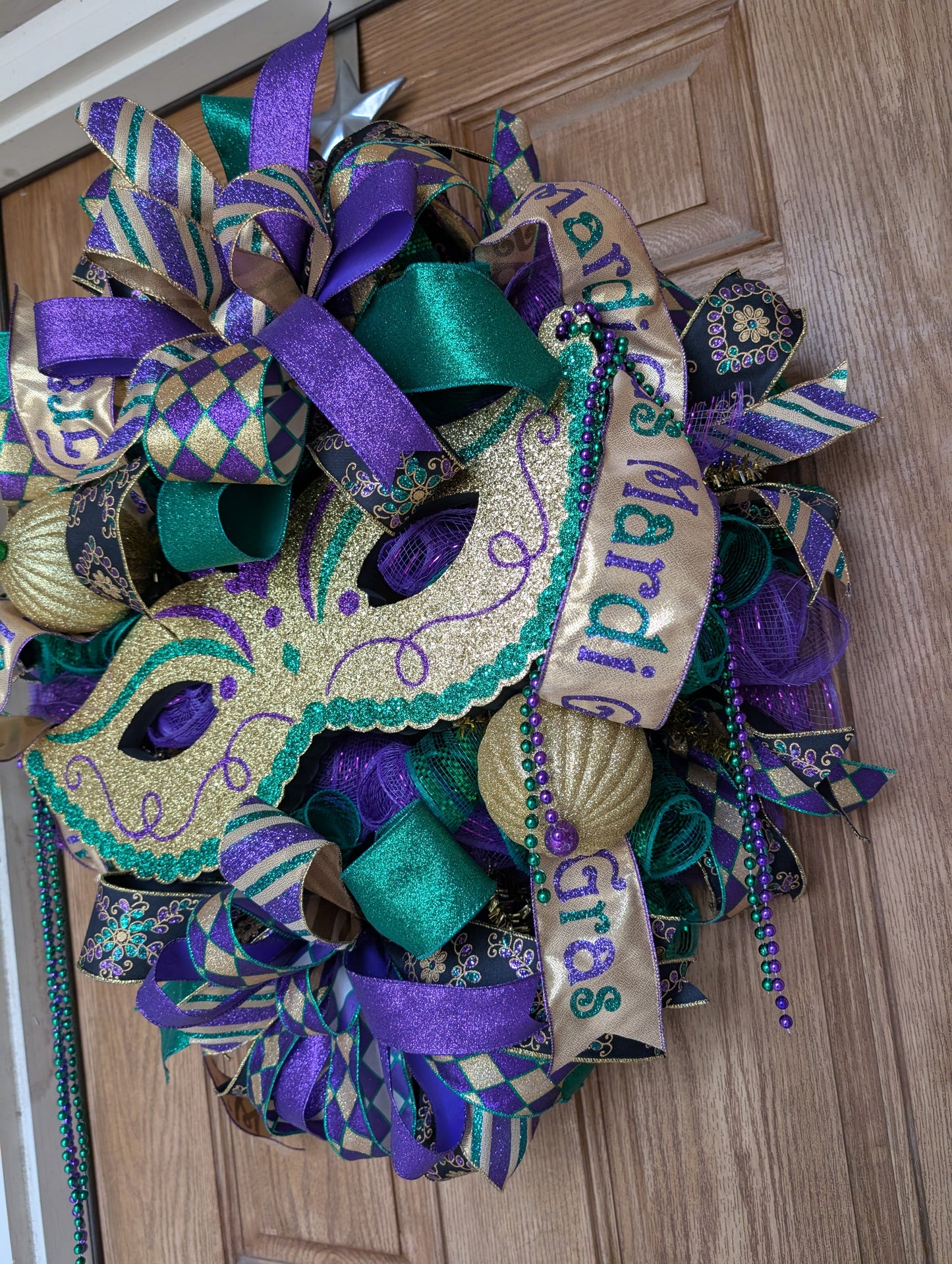 Mardi Gras mask wreath door hanger